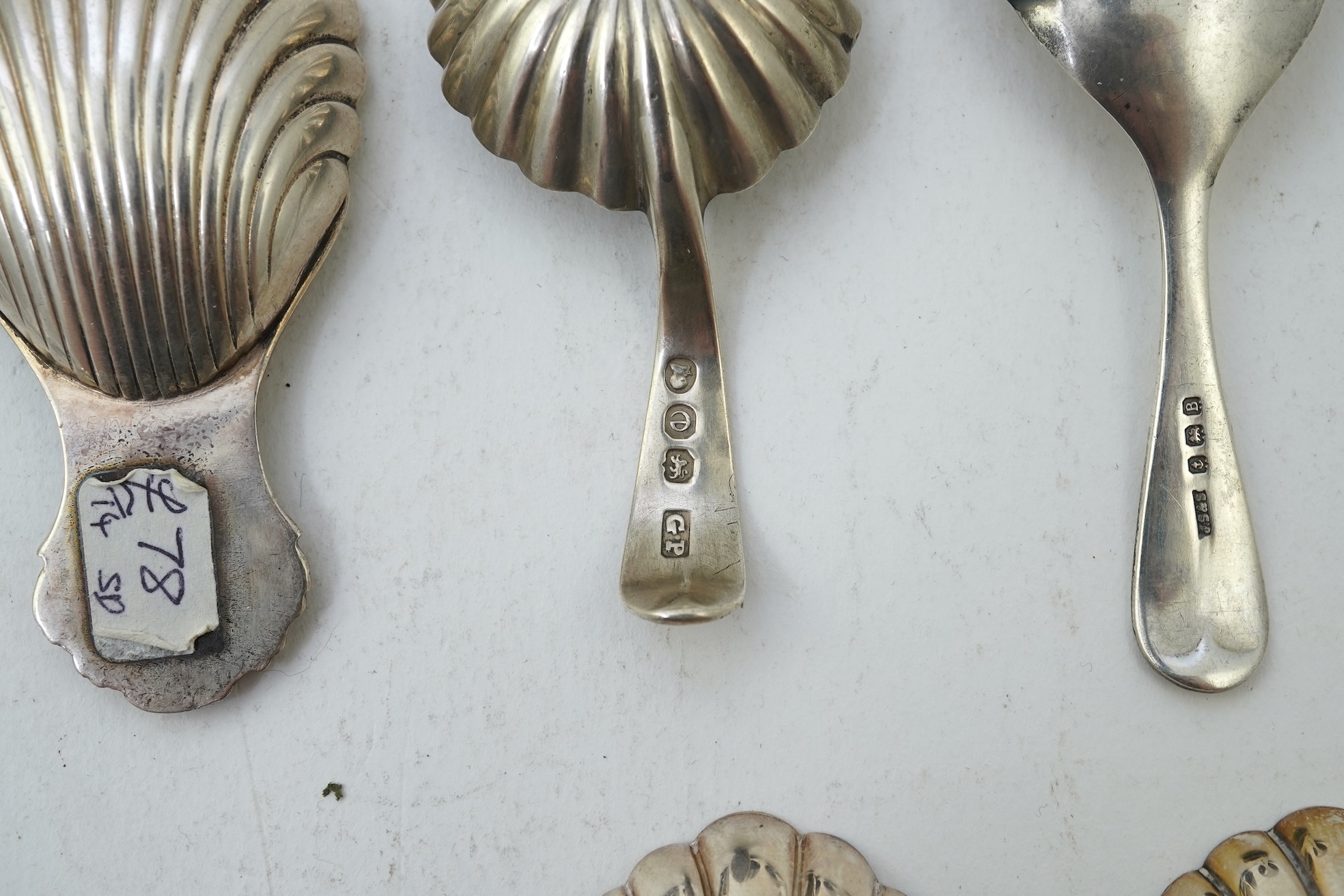 Ten assorted 19th and 20th century silver caddy spoons, with shell or fluted bowls